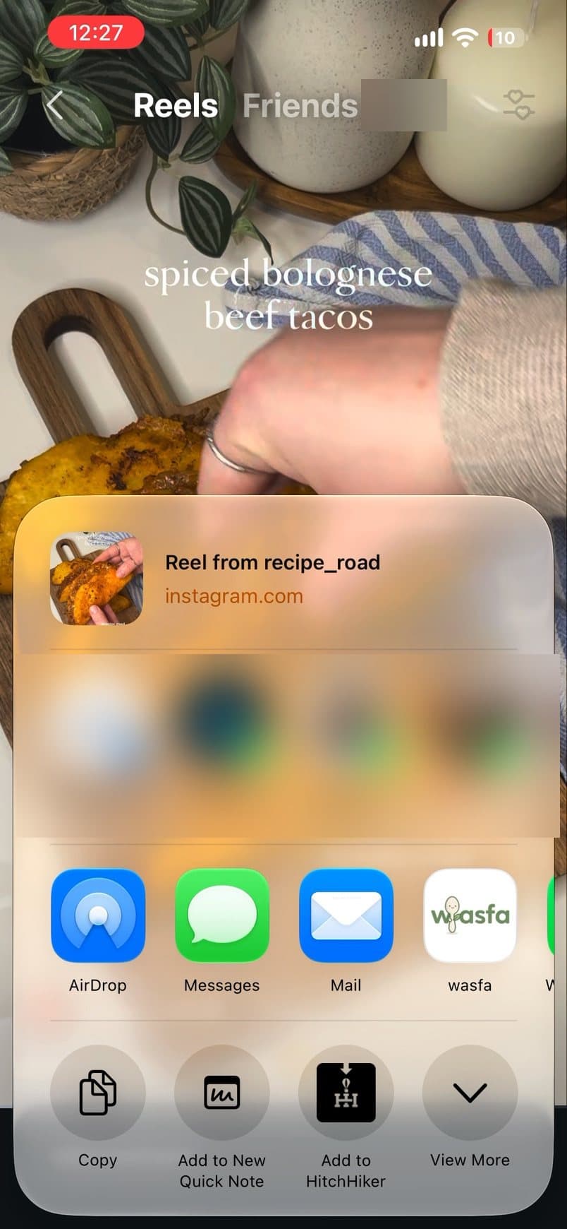 The iPhone share sheet with the Wasfa app highlighted
